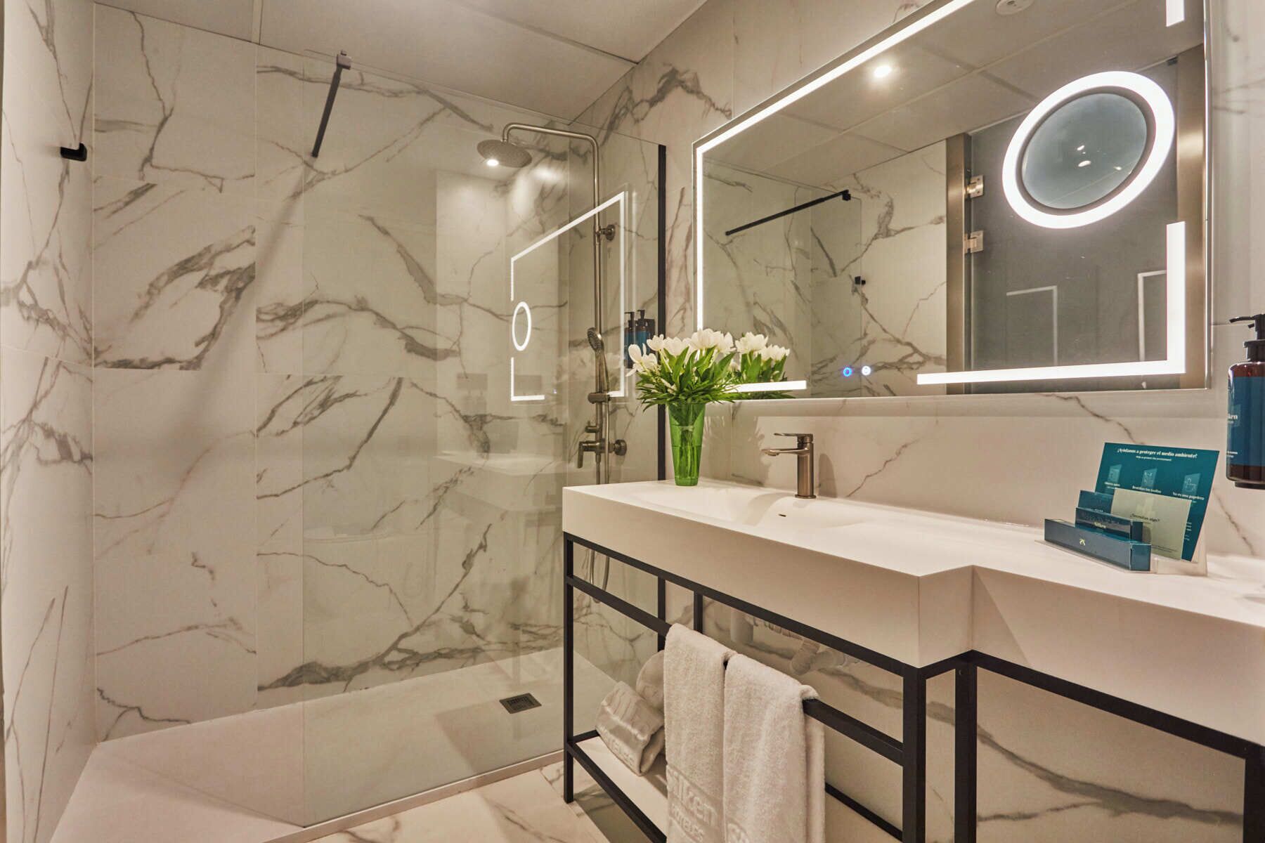 shower, designer toiletries, hair dryer, towels