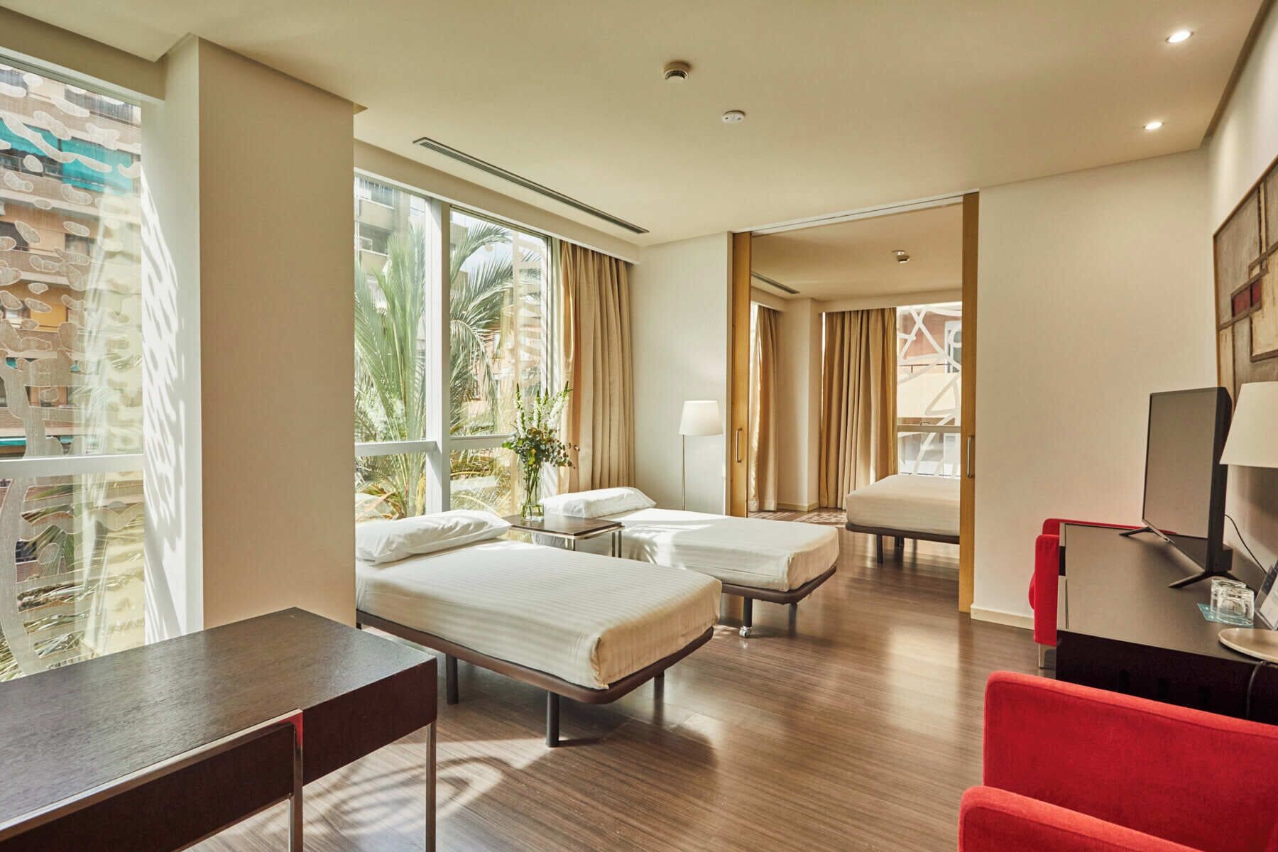 family room | minibar, in-room safe, desk, blackout curtains