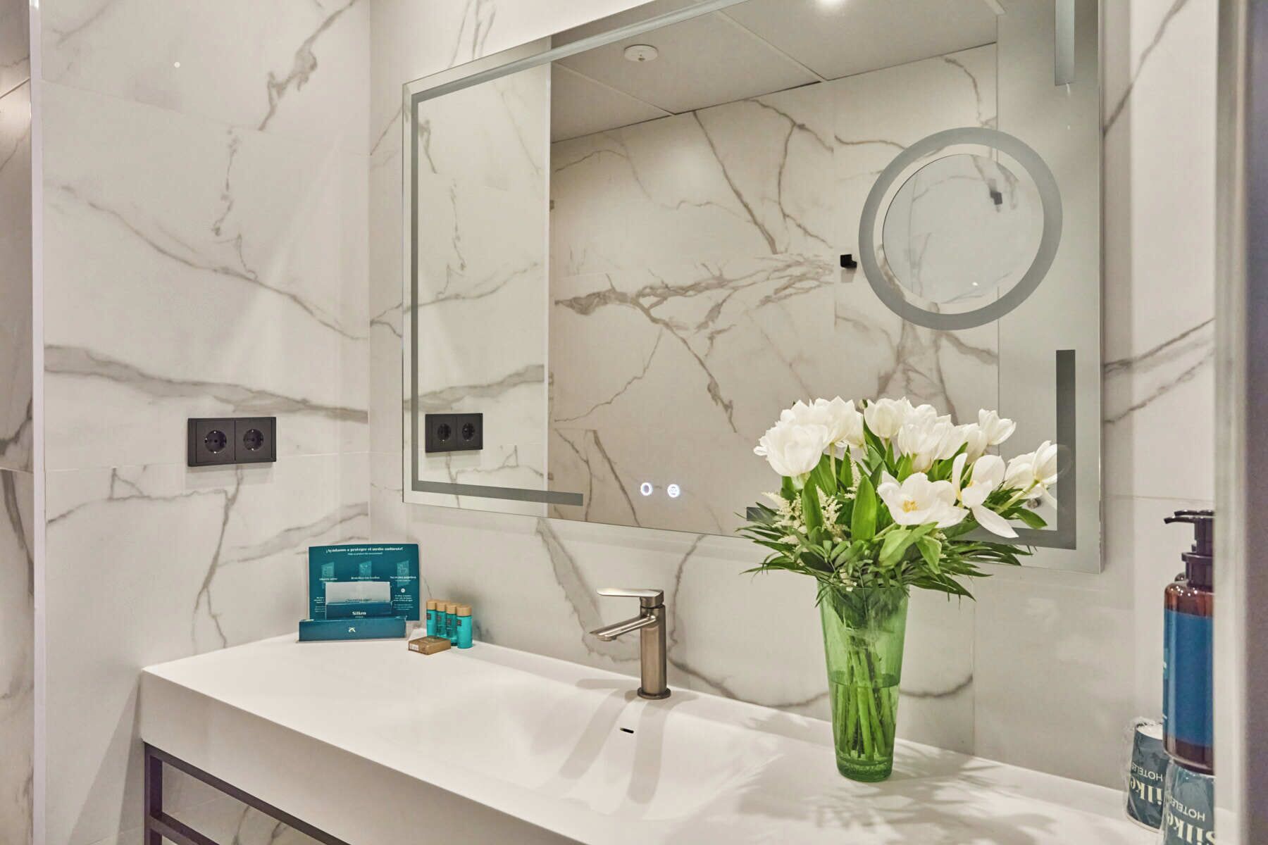 shower, designer toiletries, hair dryer, towels