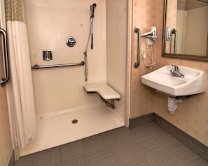 A bathroom with a walk-in shower, grab bars, a sink, and a toilet. - Hampton Inn & Suites Mountain View (Mountain View)