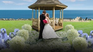 A gazebo wedding setup with a view of the ocean. - Clinton Inn And Suites (Port Clinton)
