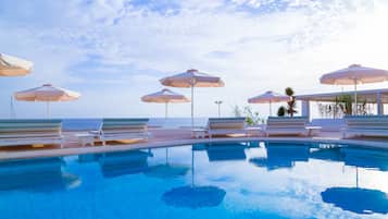 Indoor pool, outdoor pool, pool umbrellas, pool loungers