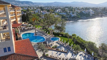 Indoor pool, outdoor pool, open 8:30 AM to 7:30 PM, pool umbrellas