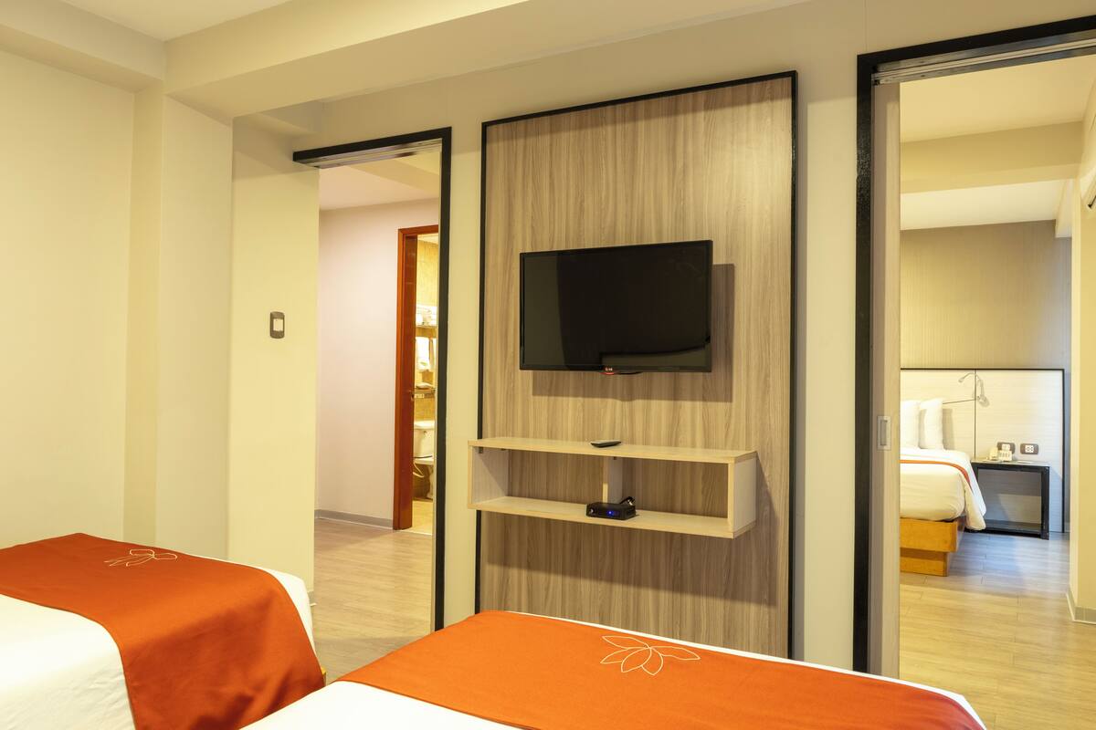 Family Room | Minibar, in-room safe, desk, blackout drapes