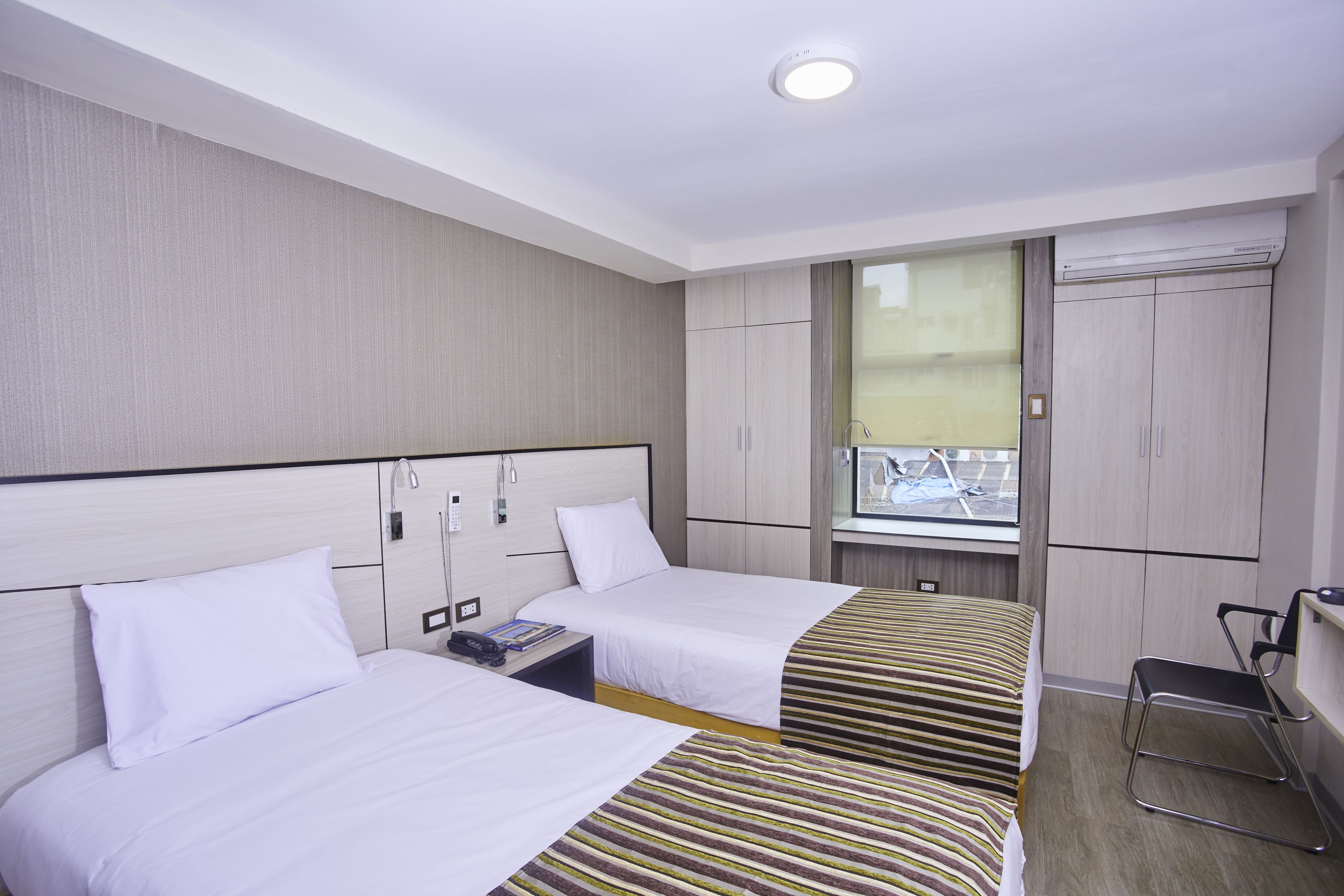 twin room | minibar, in-room safe, desk, blackout curtains