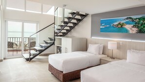 A hotel room with two beds, a staircase, a balcony with chairs, and a large window.