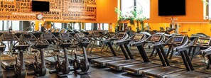 A gym with treadmills and dumbbells arranged in rows. - Art Hotel Milano (Prato)