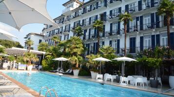 Seasonal outdoor pool, open 8:30 AM to 7:00 PM, pool umbrellas