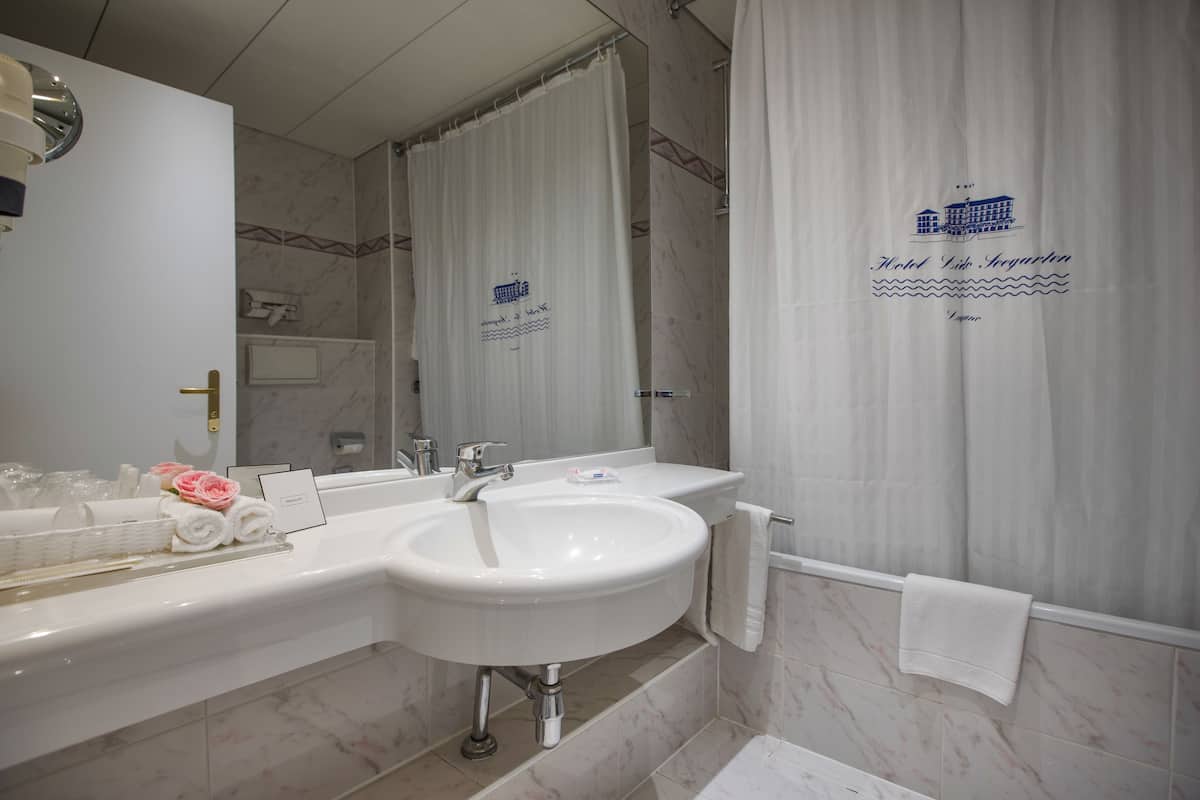 double room, balcony, mountain view | bathroom | shower, free toiletries, hair dryer, bathrobes