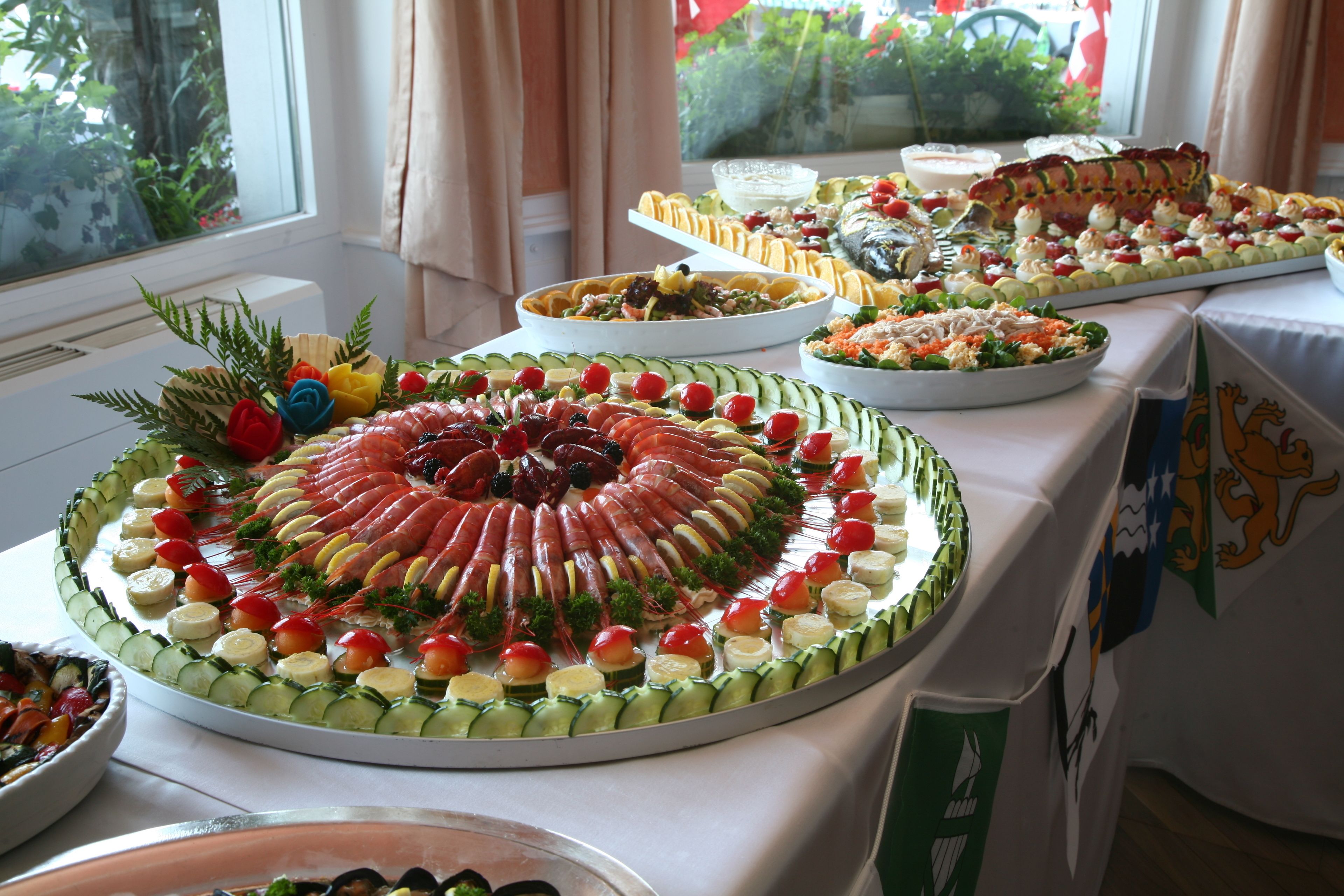 A buffet table with various food items arranged in a circular pattern.
