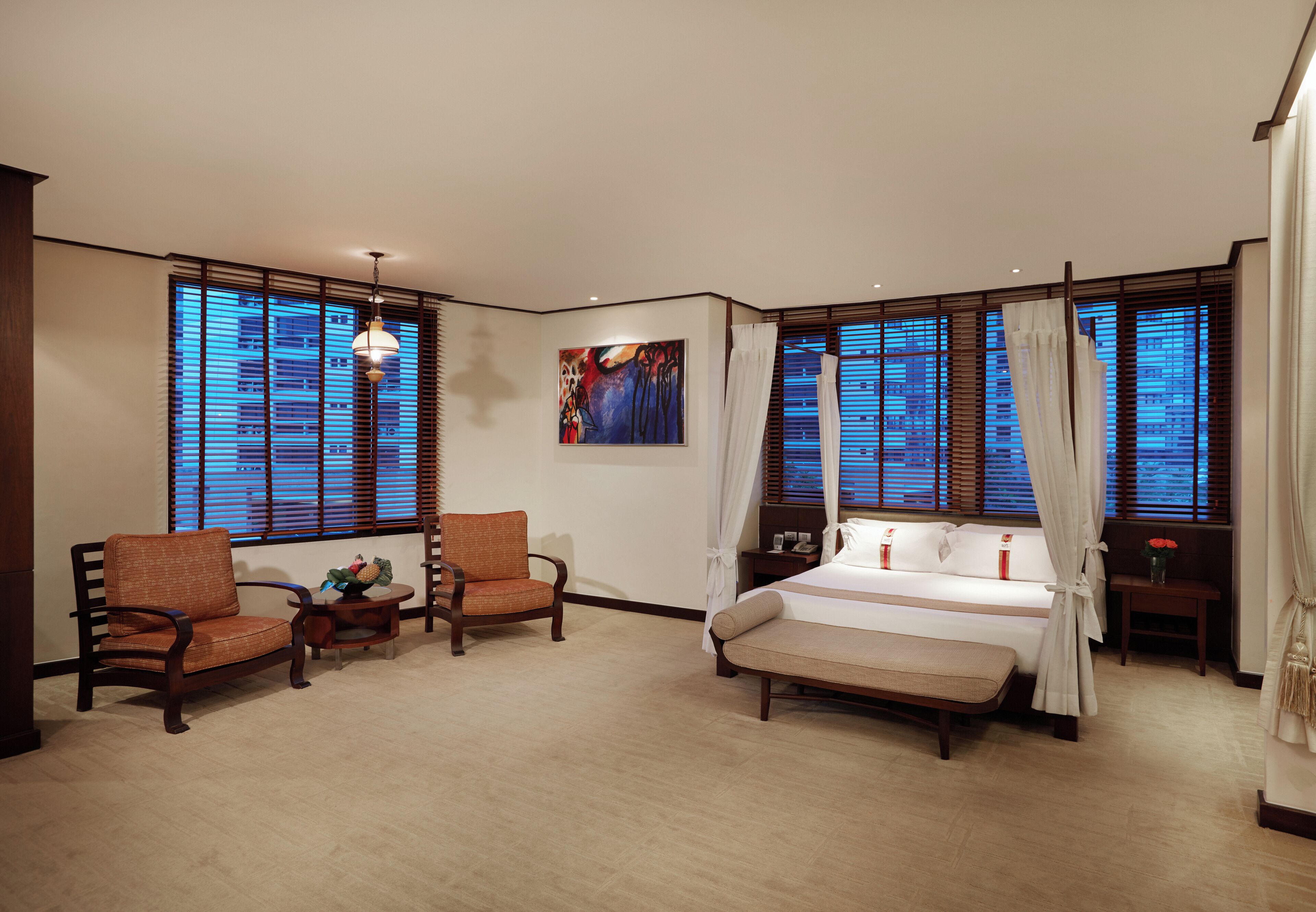 deluxe room (corner wing) | in-room safe, desk, blackout curtains, iron/ironing board