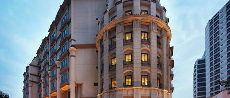 A large, historic hotel with a prominent dome and classical architecture.