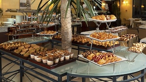 A buffet with various pastries and desserts on display. - Hotel Concorde Les Berges du Lac (Tunis)