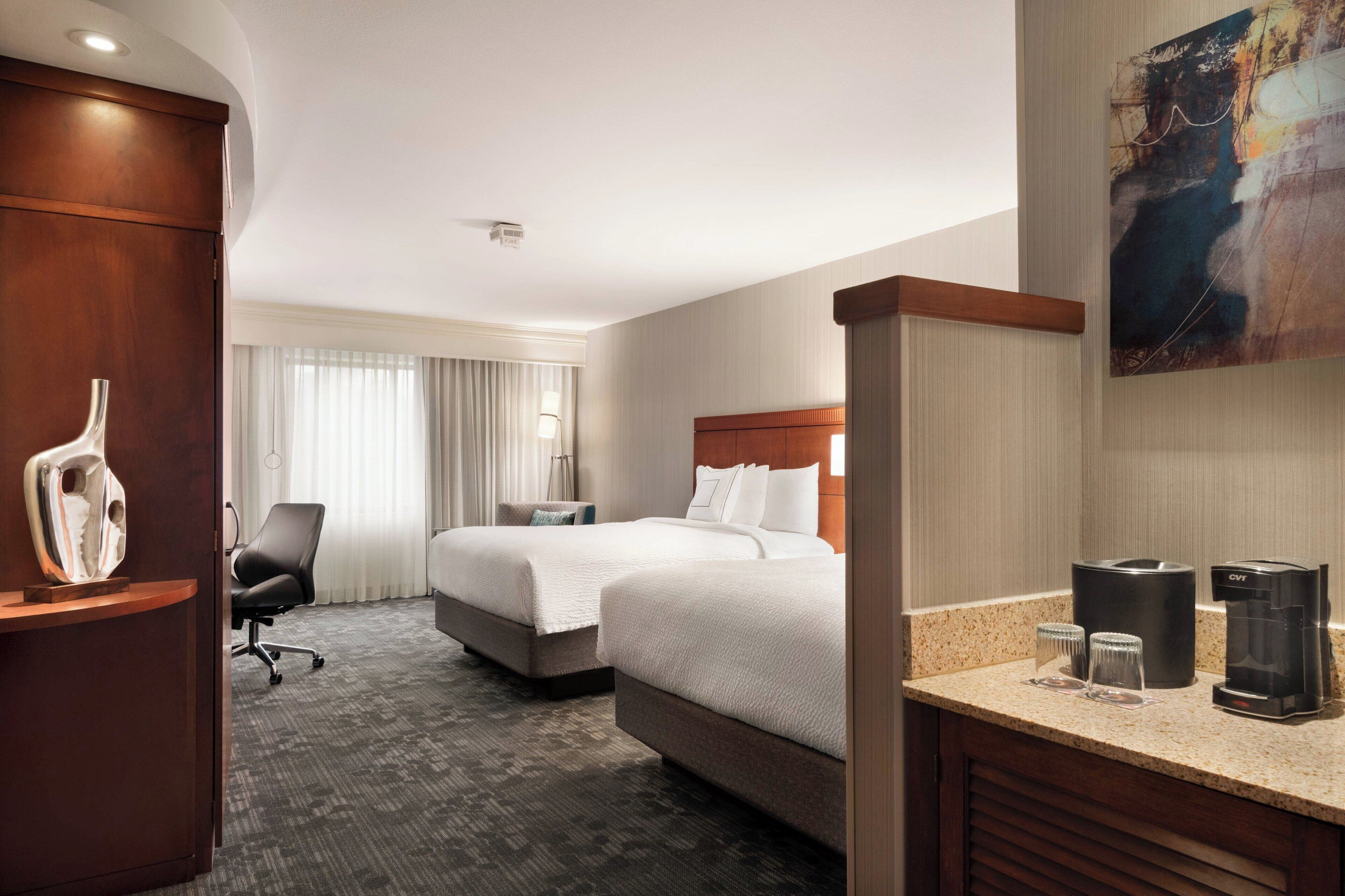 down duvets, pillow-top beds, in-room safe, desk