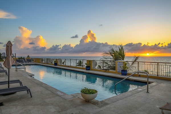 Outdoor pool, pool umbrellas, sun loungers