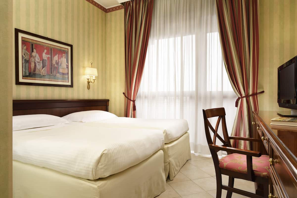 Hypo-allergenic bedding, down comforters, in-room safe, desk