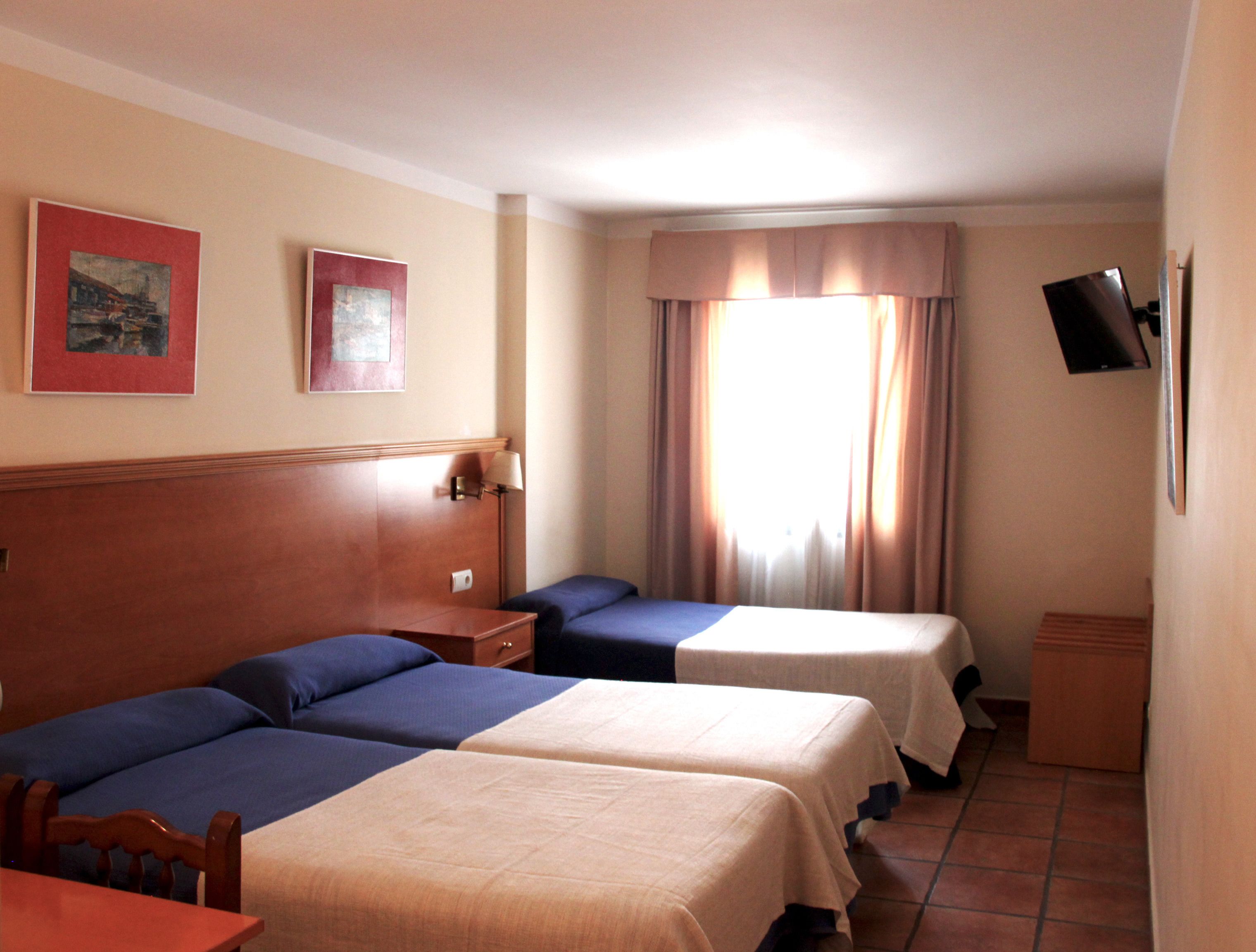 triple room | in-room safe, desk, laptop workspace, blackout curtains