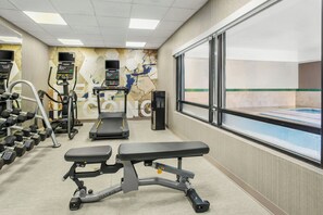 A gym with treadmills, dumbbells, and benches. - Springhill Suites by Marriott Morgantown (Morgantown)