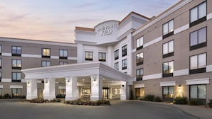 A modern hotel with a prominent entrance, multiple floors, and a well-lit facade. - SpringHill Suites by Marriott Fort Worth University (Fort Worth)