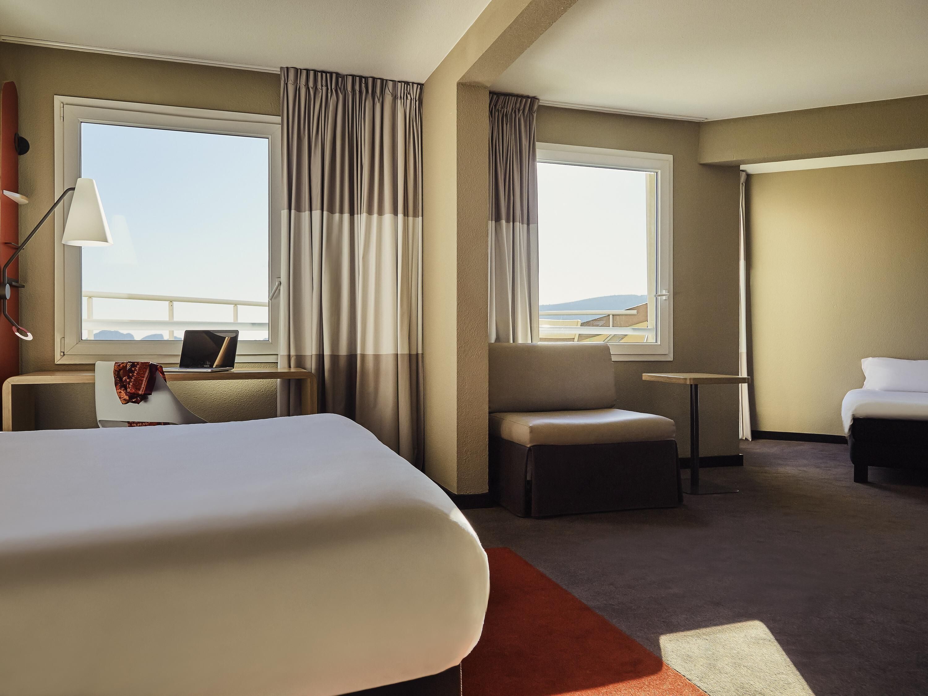 premium bedding, pillow-top beds, desk, blackout curtains