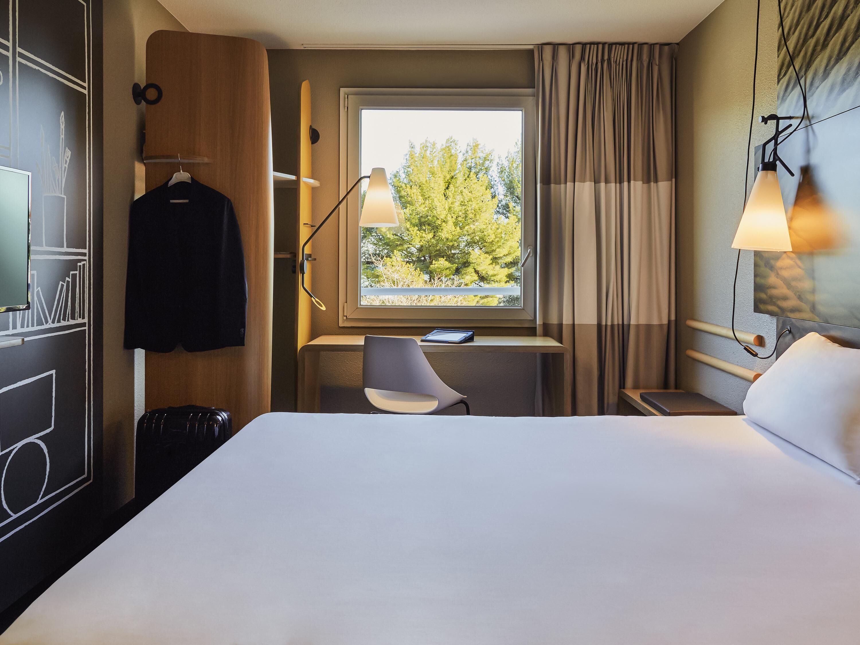 Premium bedding, pillowtop beds, desk, blackout drapes