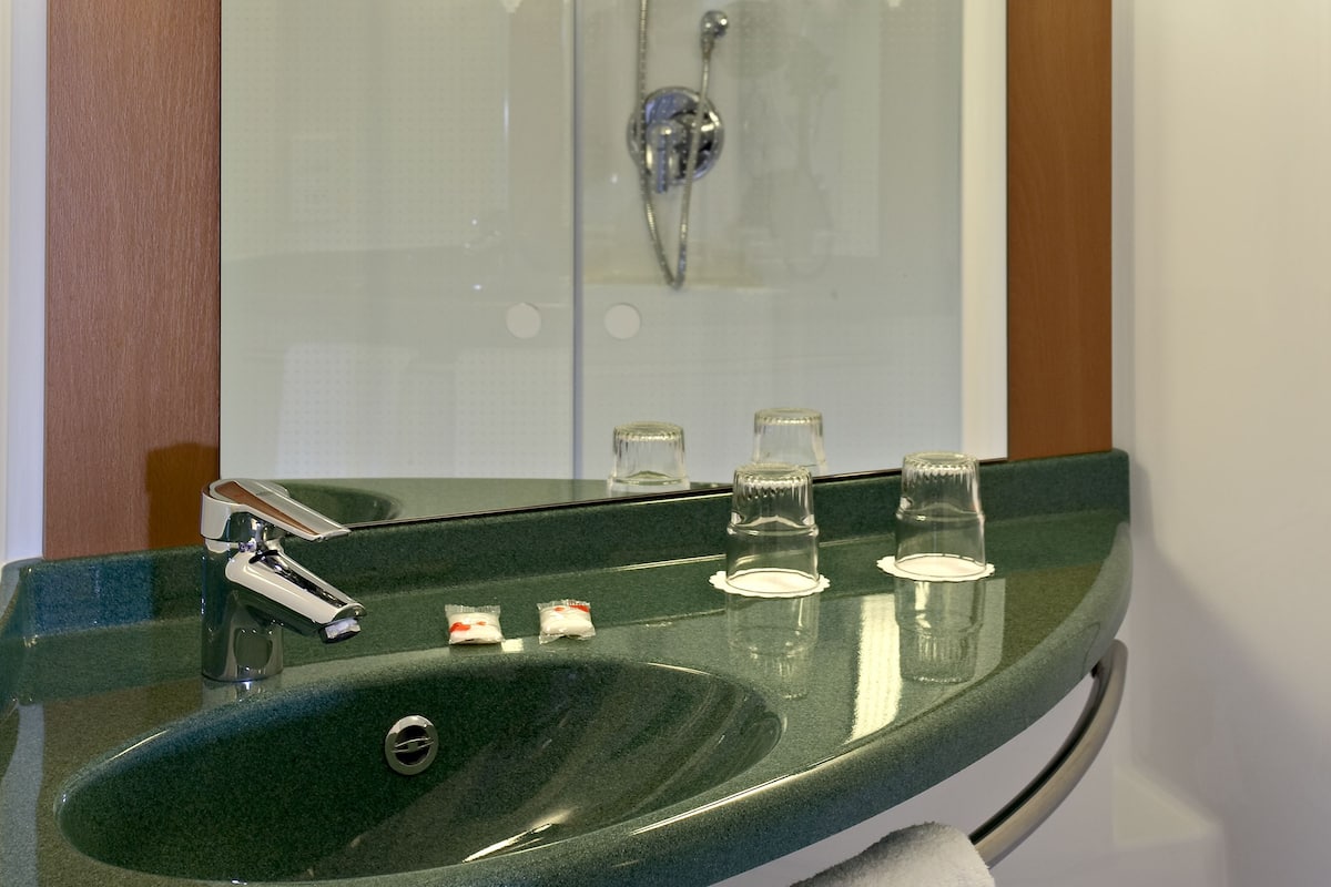 shower, eco-friendly toiletries, hair dryer, towels