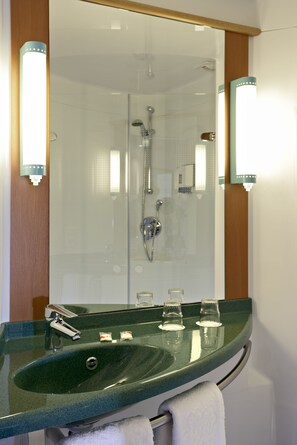 Shower, eco-friendly toiletries, hair dryer, towels