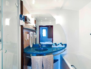 Separate bathtub and shower, eco-friendly toiletries, hair dryer, towels