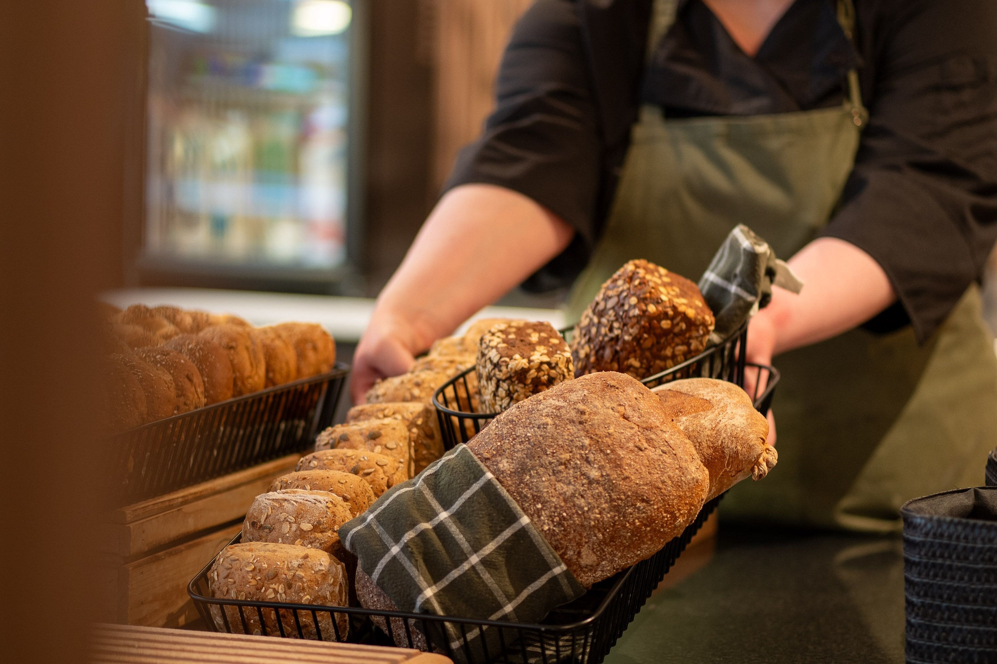 A bakery display with various types of bread.