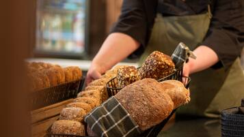 A bakery display with various types of bread.