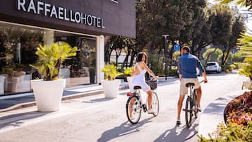 A modern hotel entrance with a sign reading "RAFFAELLOHOTEL".