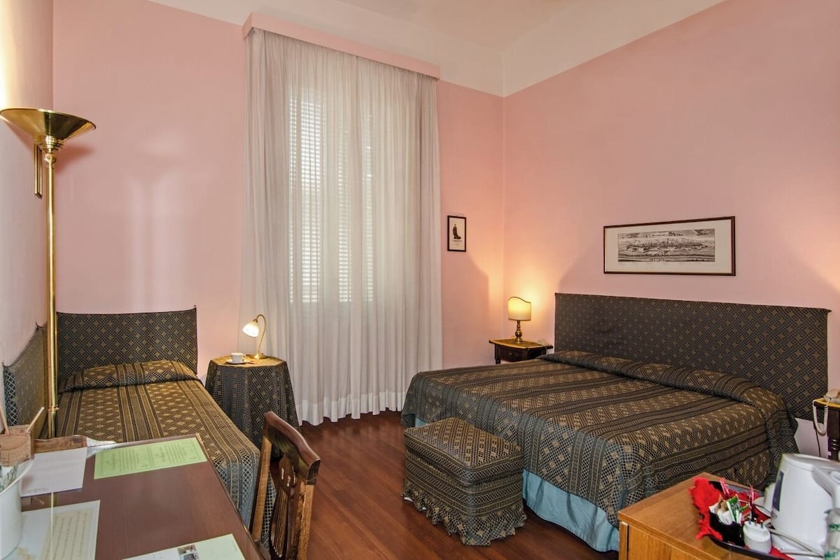 Standard Triple Room | Minibar, in-room safe, desk, soundproofing