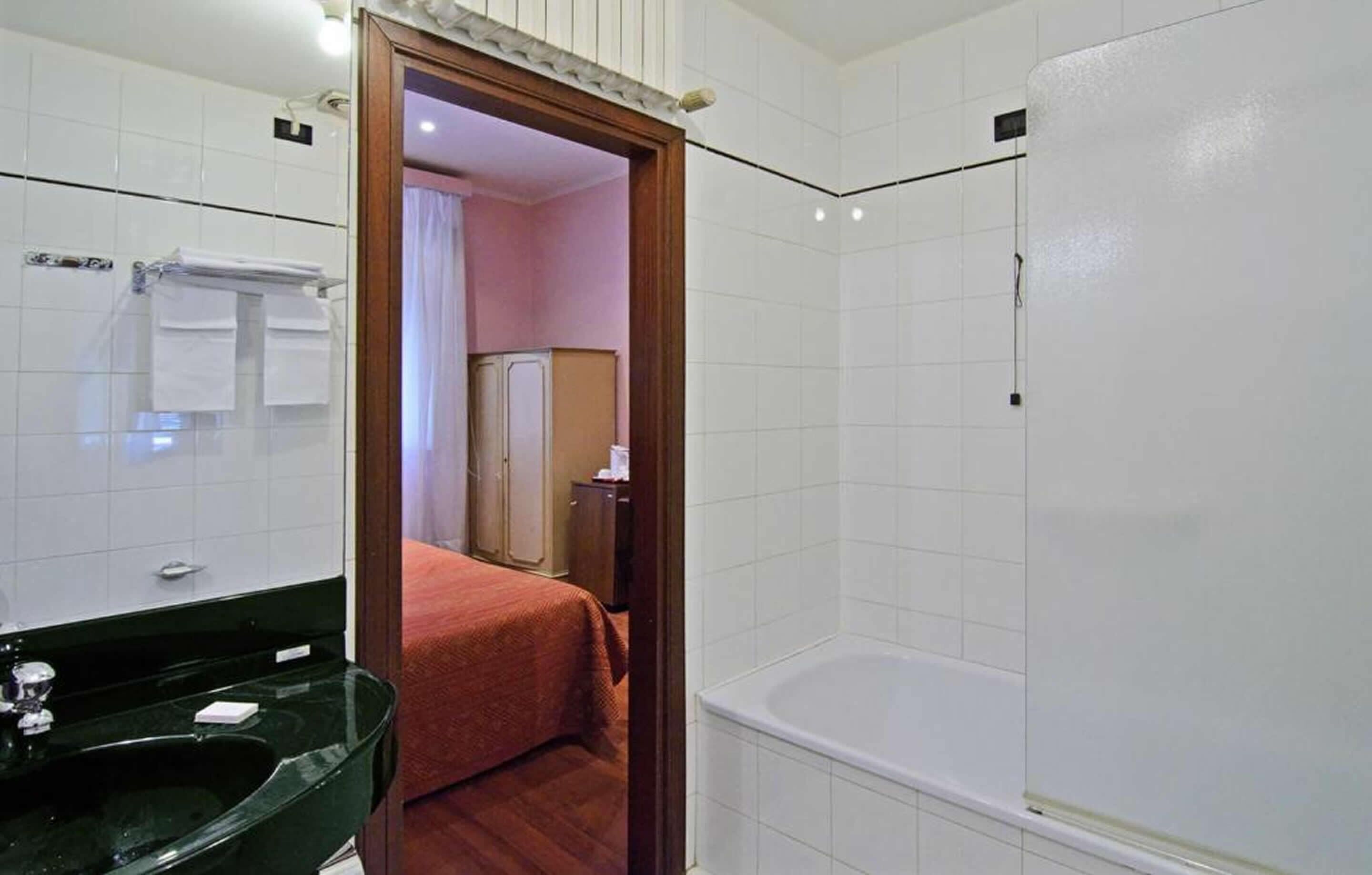 standard double or twin room | bathroom | deep-soaking bathtub, free toiletries, hair dryer, bidet