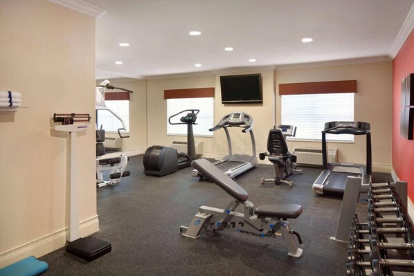 A gym with treadmills, a stationary bike, and free weights. - Country Inn & Suites by Radisson, Champaign North, IL (Champaign)