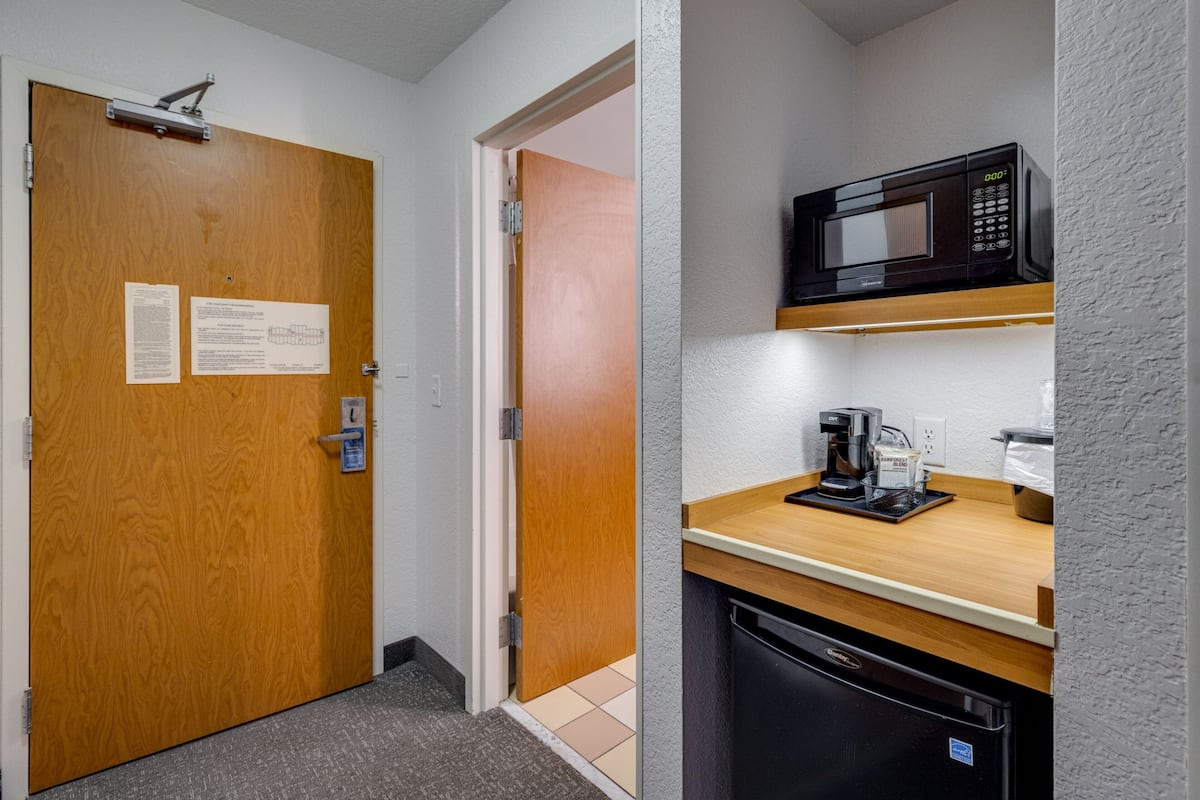 desk, laptop workspace, blackout curtains, iron/ironing board