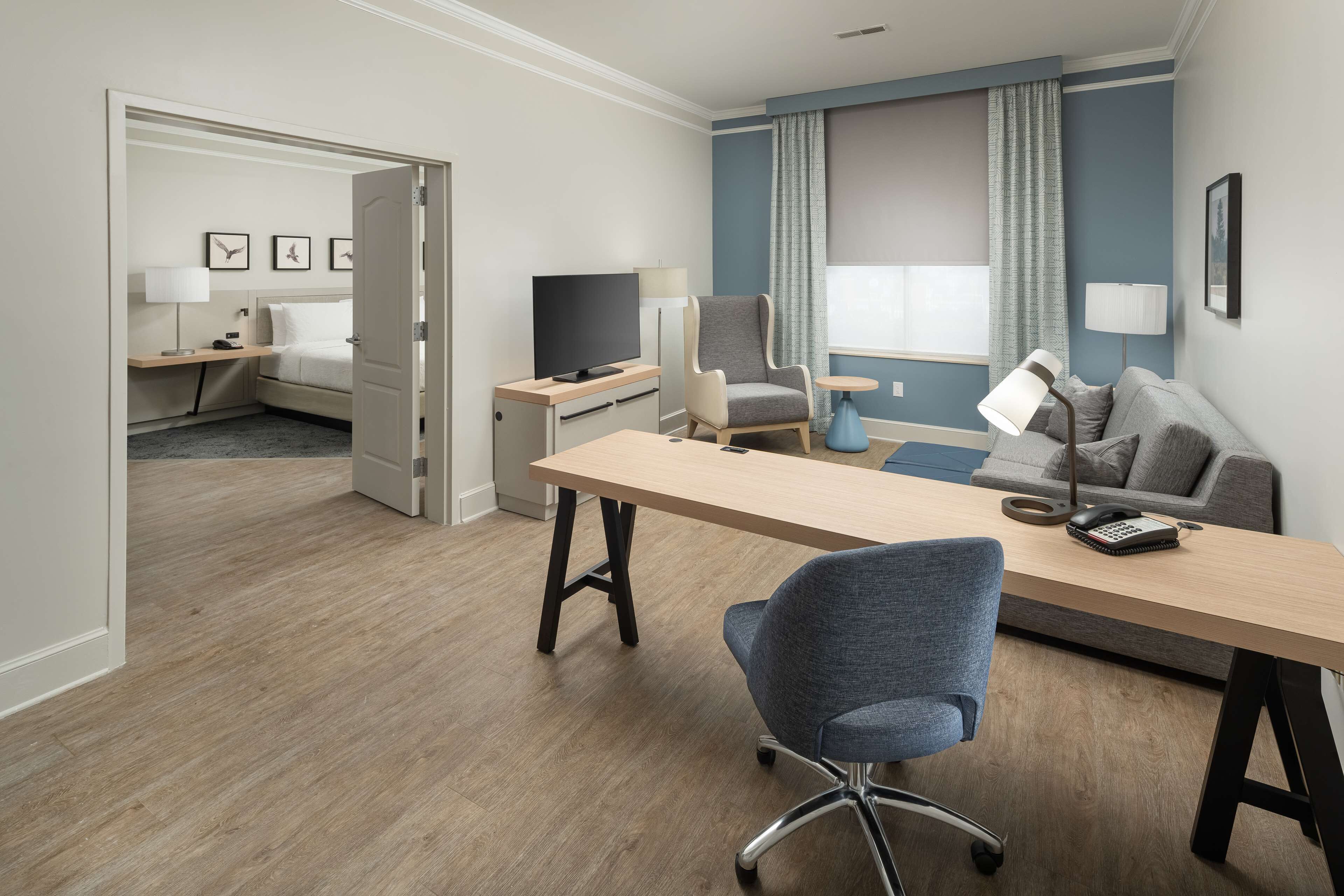 suite | in-room safe, desk, blackout curtains, iron/ironing board