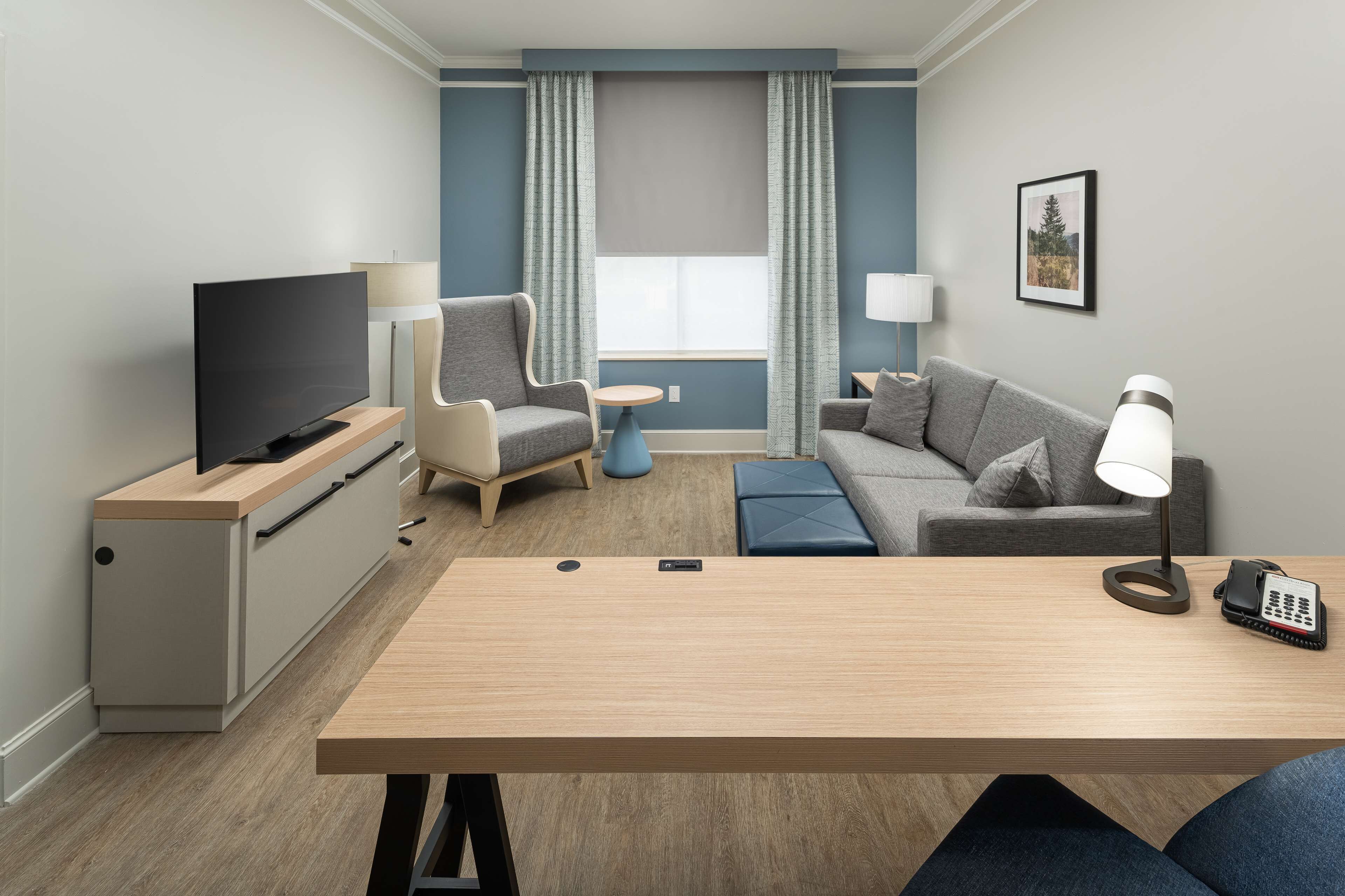 suite | in-room safe, desk, blackout curtains, iron/ironing board