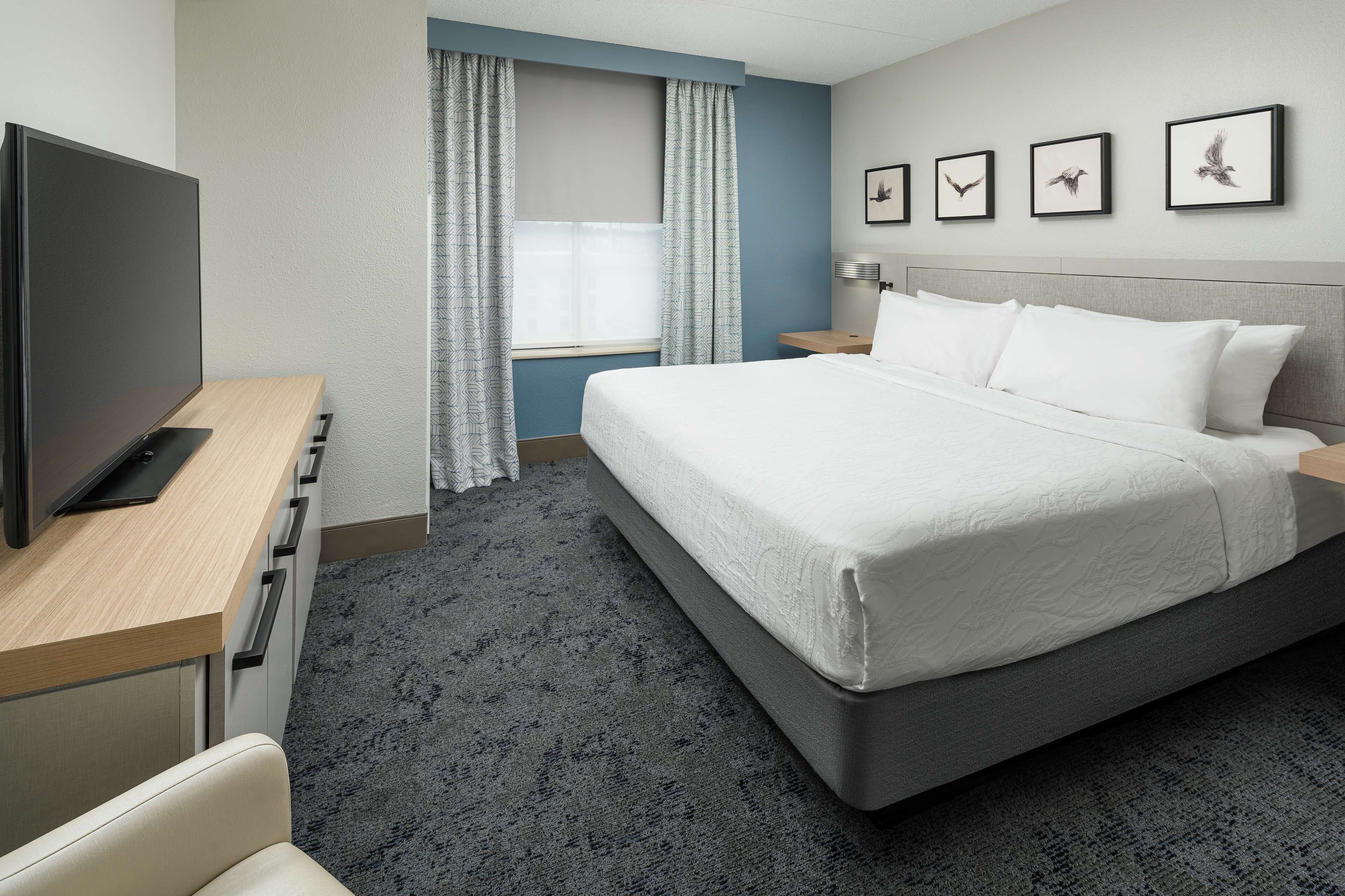 junior suite, 1 king bed | in-room safe, desk, blackout curtains, iron/ironing board