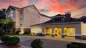A hotel with a sign reading "Homewood Suites by Hilton" and a well-lit entrance. - Homewood Suites by Hilton Montgomery (Montgomery)