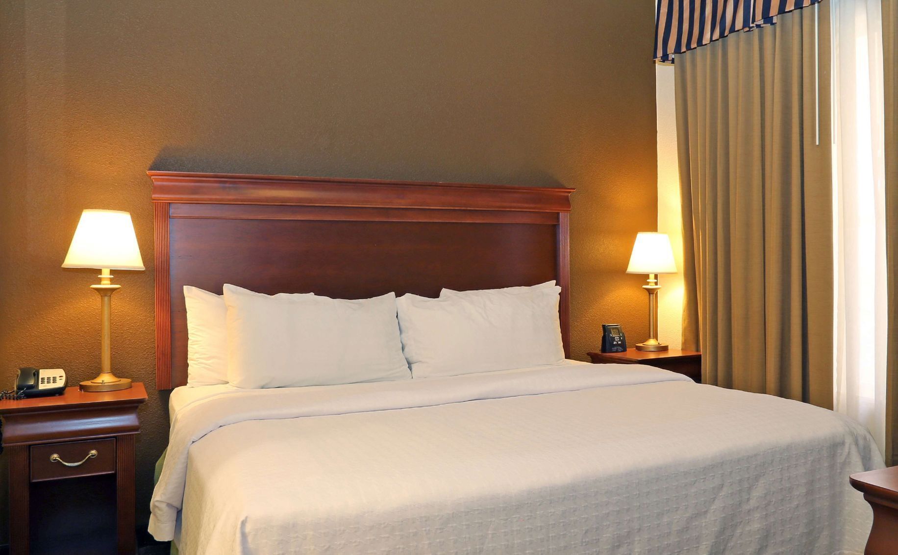 Hypo-allergenic bedding, down comforters, pillowtop beds, in-room safe