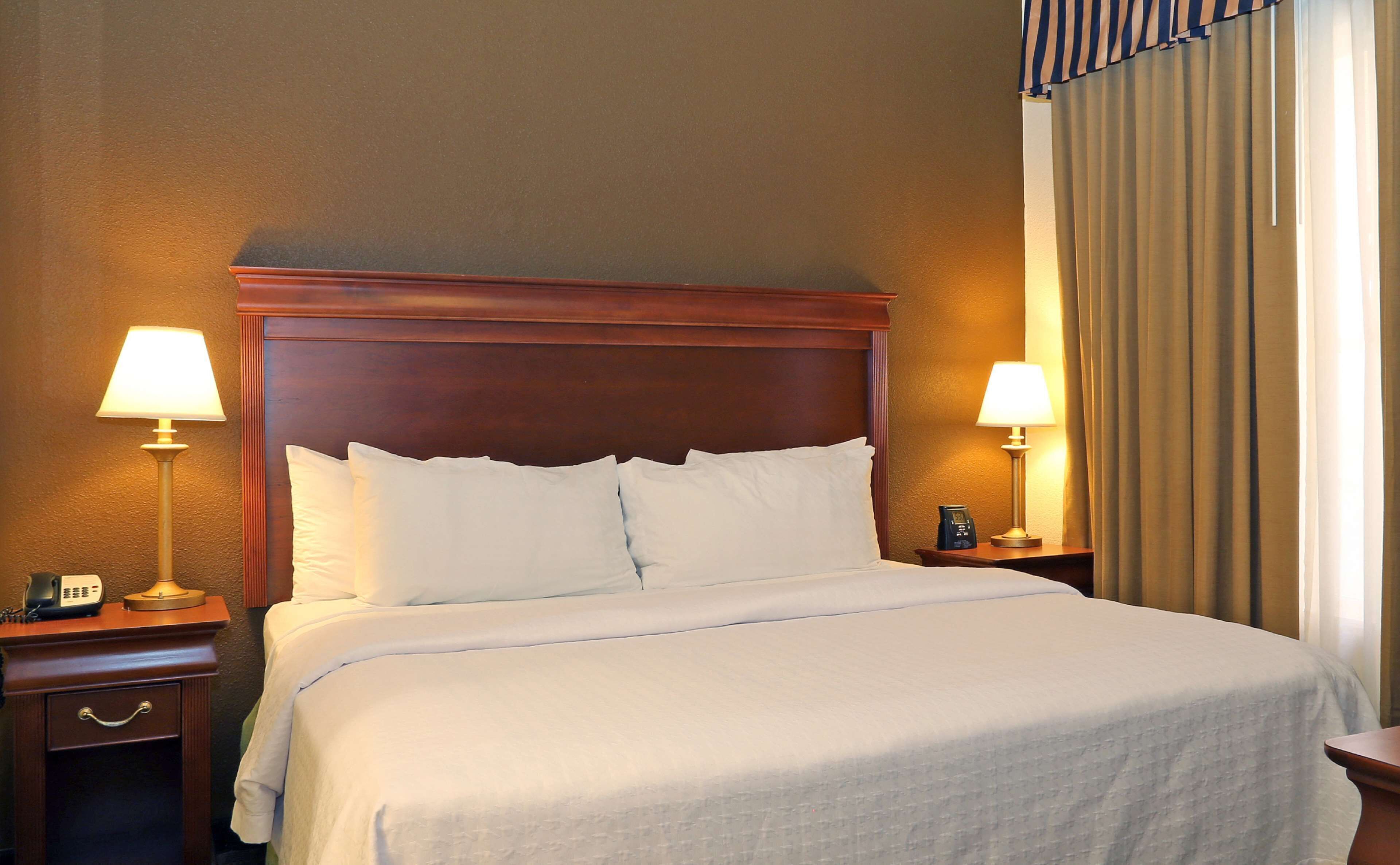 Hypo-allergenic bedding, down comforters, pillowtop beds, in-room safe