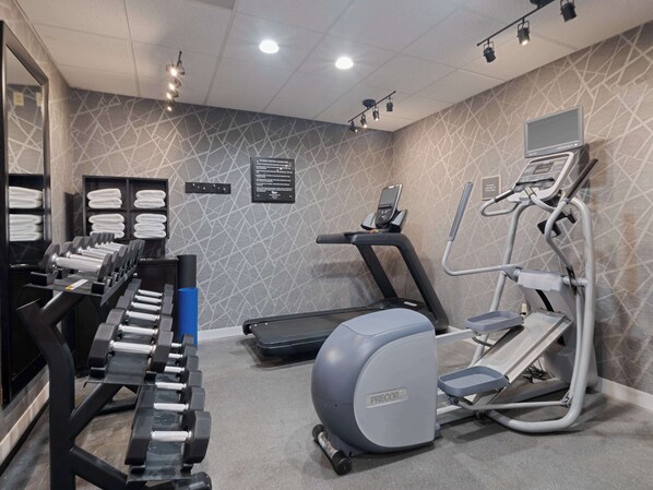 A gym with treadmills, elliptical machines, and dumbbells. - Homewood Suites by Hilton Columbia (Columbia)