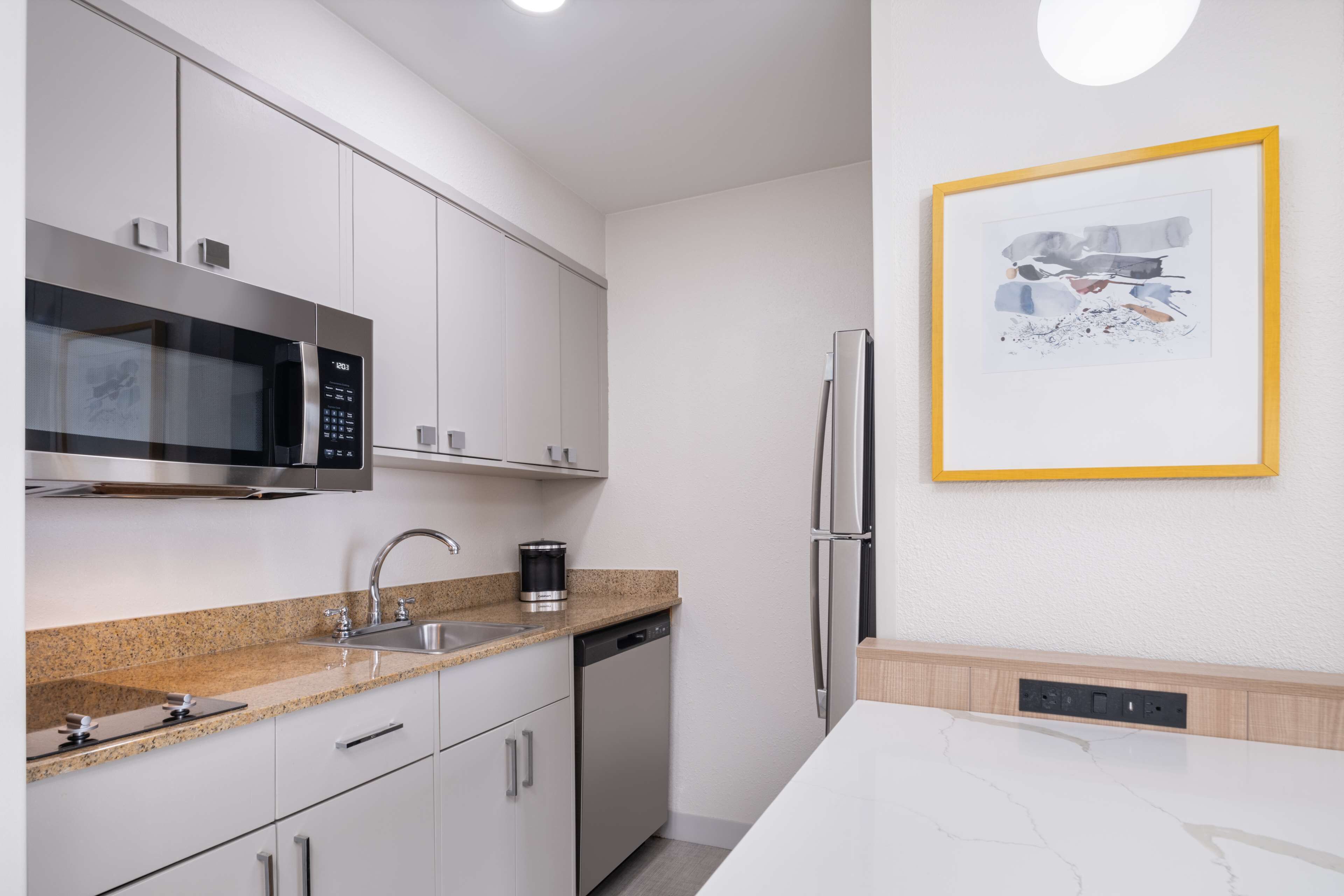 full-sized fridge, microwave, stovetop, dishwasher