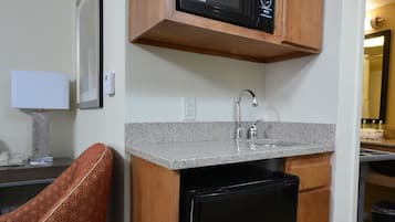 Premium bedding, desk, laptop workspace, blackout drapes