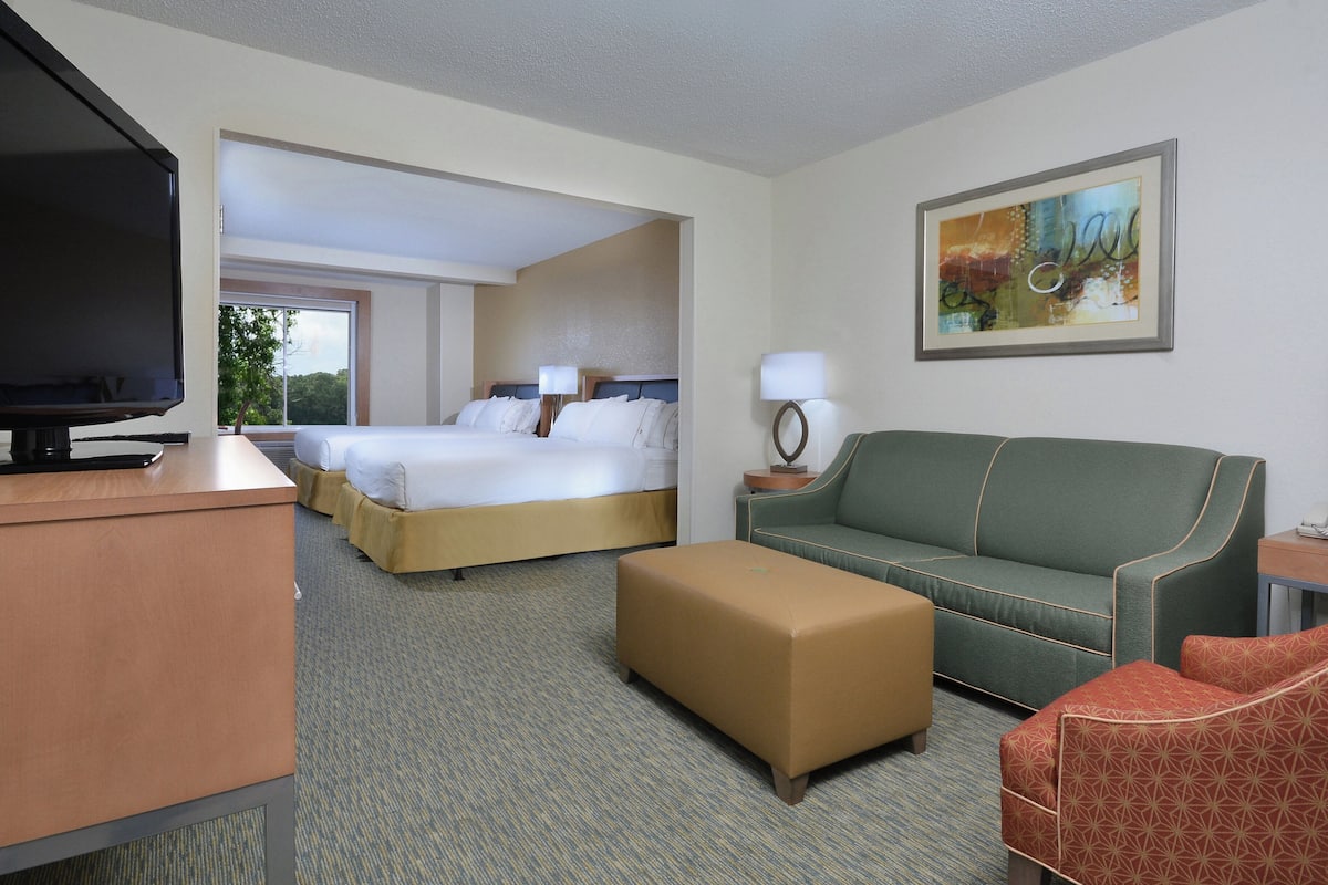 Premium bedding, desk, laptop workspace, blackout curtains
