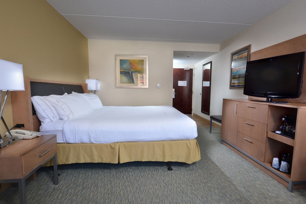 Premium bedding, desk, laptop workspace, iron/ironing board