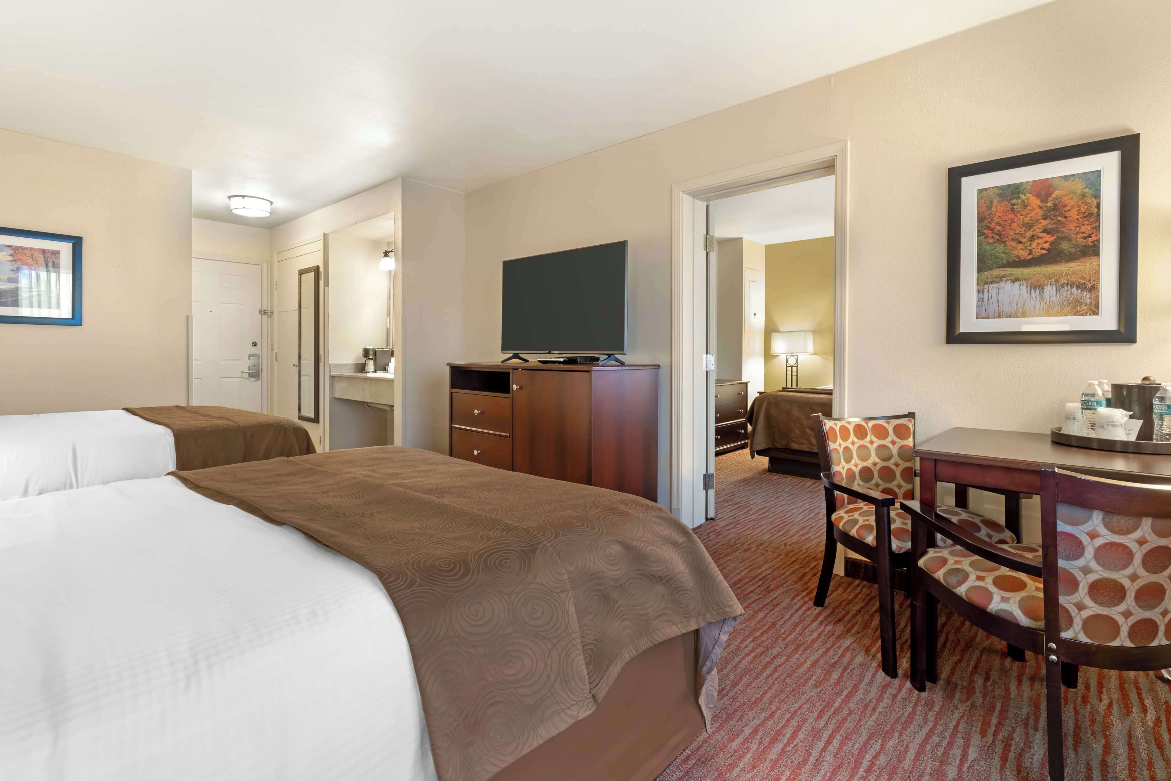 suite, multiple beds, non smoking, refrigerator & microwave | blackout curtains, iron/ironing board, cots/infant beds, rollaway beds