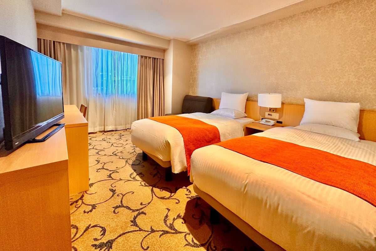 ห้องดีลักซ์ทวิน, ปลอดบุหรี่, อาคารเสริม | เครื่องนอนระดับพรีเมียม, ผ้านวมขนเป็ด, ตู้นิรภัยในห้องพัก, ผ้าม่านกันแสง