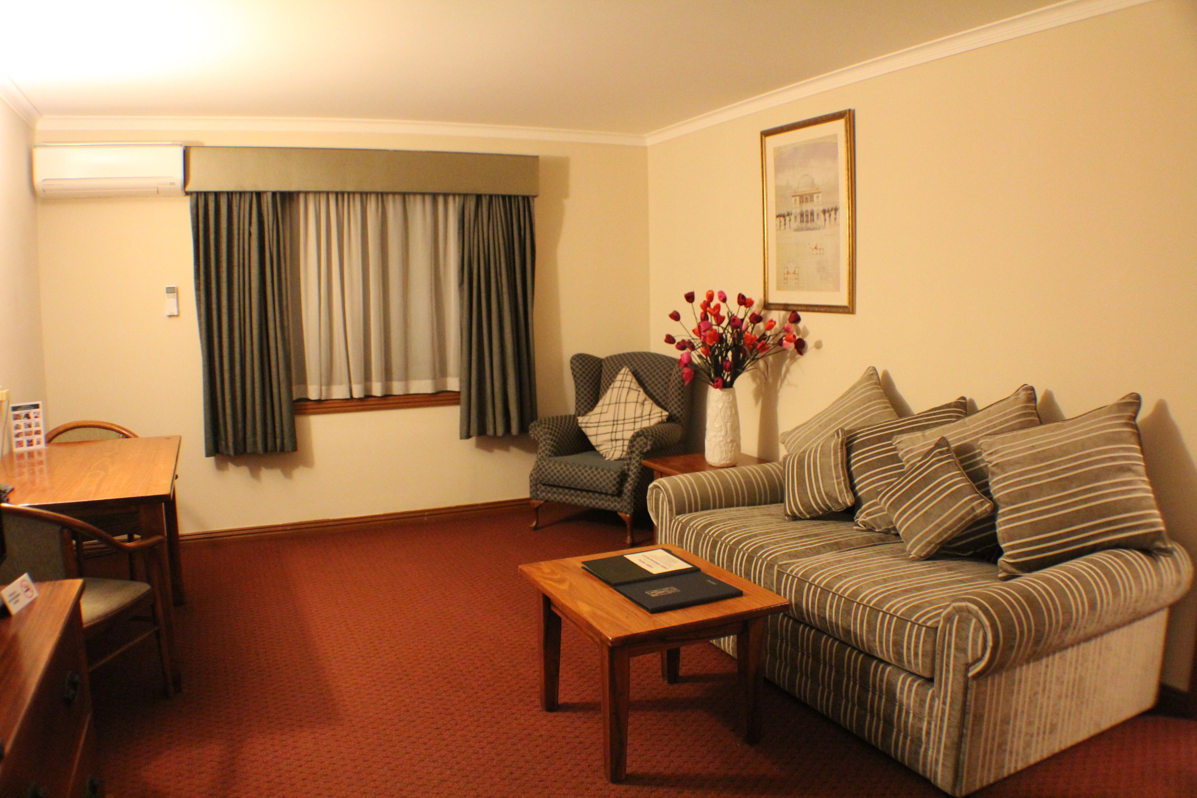 executive king room | living area | 50-inch tv with digital channels