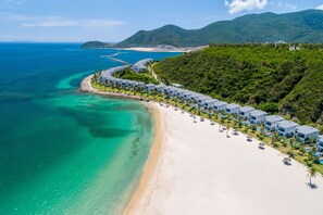A coastal resort with beachfront villas, clear turquoise waters, and lush greenery. - Vinpearl Resort Nha Trang  (Nha Trang)